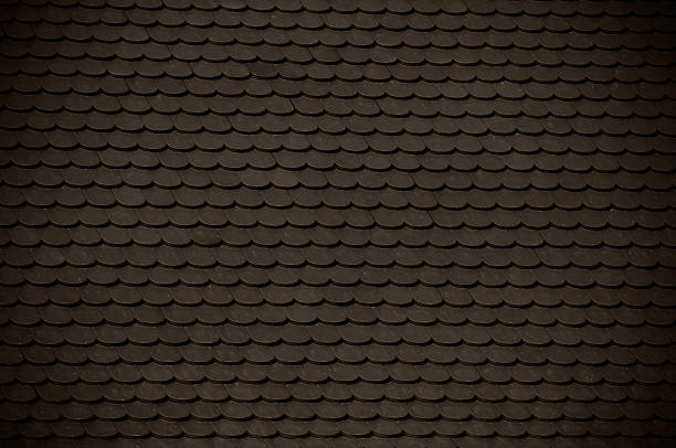 istock dark clay roof tile background 178935526