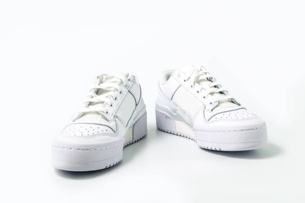 istock White tennis shoes on white 1789373037