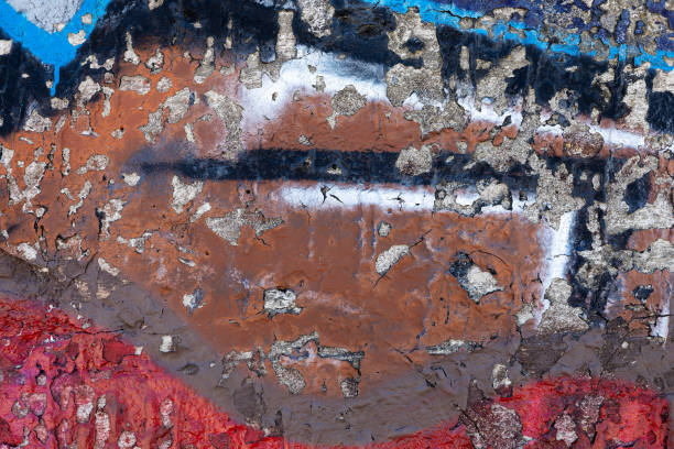 istock Brown old plastered concrete wall with cracked and fallen paint, texture for background 1789403808