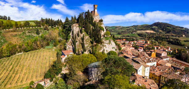 one of the most beautiful medieval villages of Italy, Emilia romagna region- Brisighella in Ravenna province one of the most beautiful medieval villages of Italy, Emilia romagna region- Brisighella in Ravenna province, panoramic view of the village and clock tower ancient villages stock pictures, royalty-free photos & images