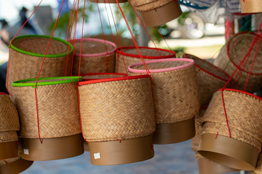 This picture is a sticky rice container for Isaan Thai people. They are smart people. Natural bamboo can be woven into many useful items such as cylinders for holding sticky rice, baskets, animal trapping equipment, chairs, beds, and many more.