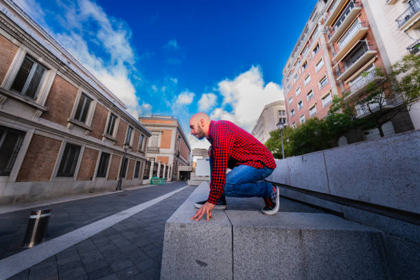 istock Casual, bald parkour enthusiast in Madrid sun. 1789451243