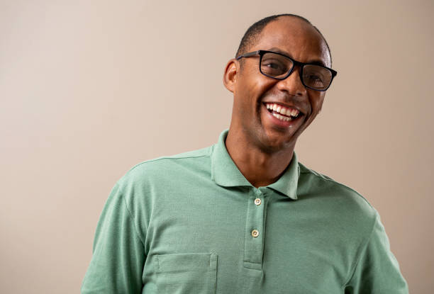 istock Man wearing glasses smiling on pastel background. 1789452935