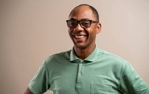 istock Black man wearing glasses smiling on pastel background. 1789453472