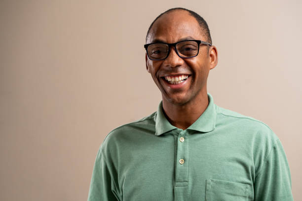 istock Man wearing glasses smiling on pastel background. 1789454035