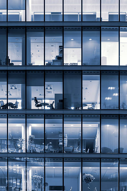 istock Illuminated office buildings in London 178945437