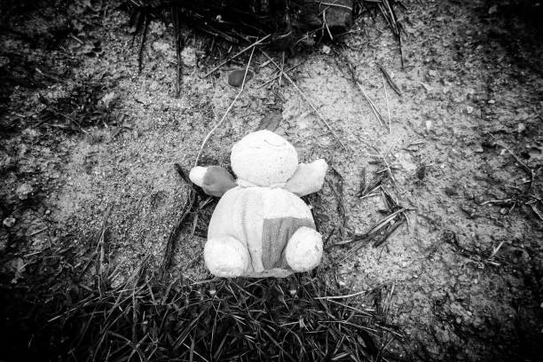 Detail of old abandoned and dirty toy, garbage and pollution