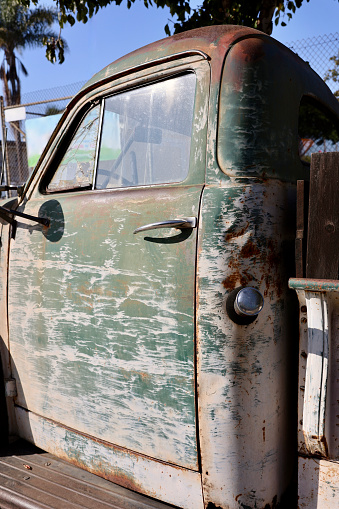 1930’s vintage rusty and dented pickup truck