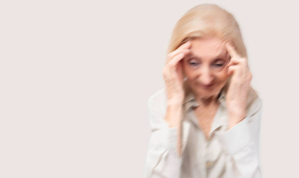 istock Elderly woman massaging temples touching aching head feeling strong headache or migraine Faint tired stressed elderly senior mature lady suffering from pain or dizziness Health care Medical concept 1789473597