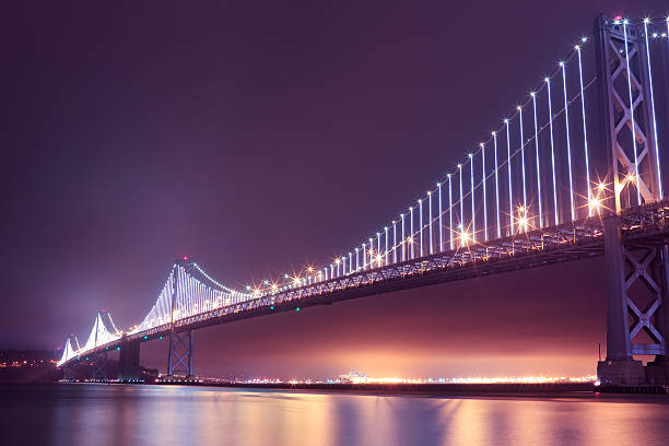 istock The bay bridge at night, full of lights 178947442