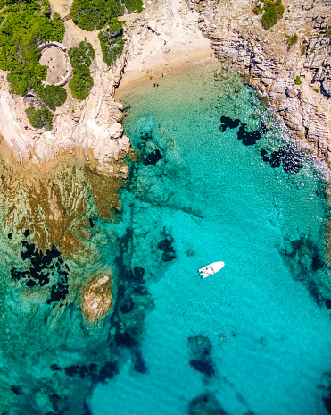 Italy, Sardinia, Olbia region, drone view over the transparent sea at solitary beach in Molara island