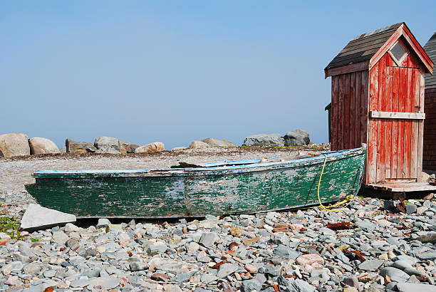 istock Outhouse and old Boat on Rocky Beach 178952124