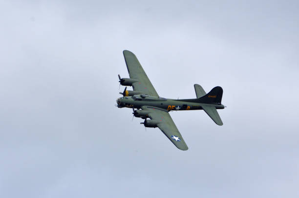 Ickwell, Bedfordshire, England - July 02, 2023: Vintage  B-17 Flying Fortress G-BEDF Sally B in flight blue sky.