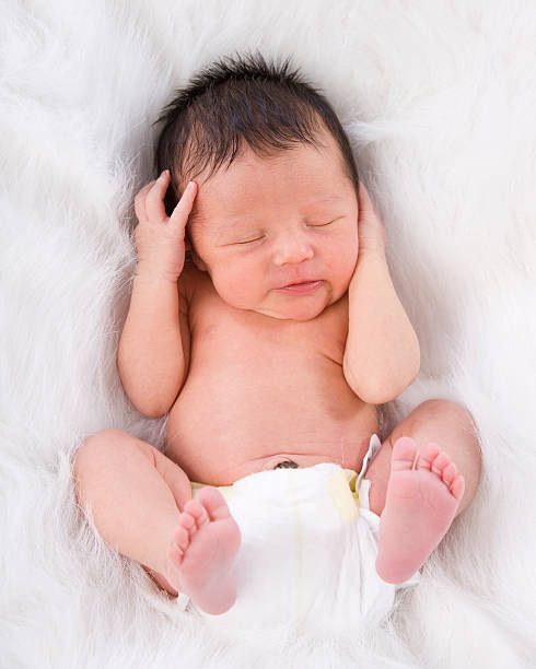 istock A precious newborn baby still attached to umbilical cord 178952780