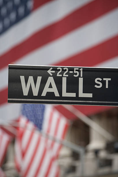 istock Wall Street Sign with American Flag in Background 178954283
