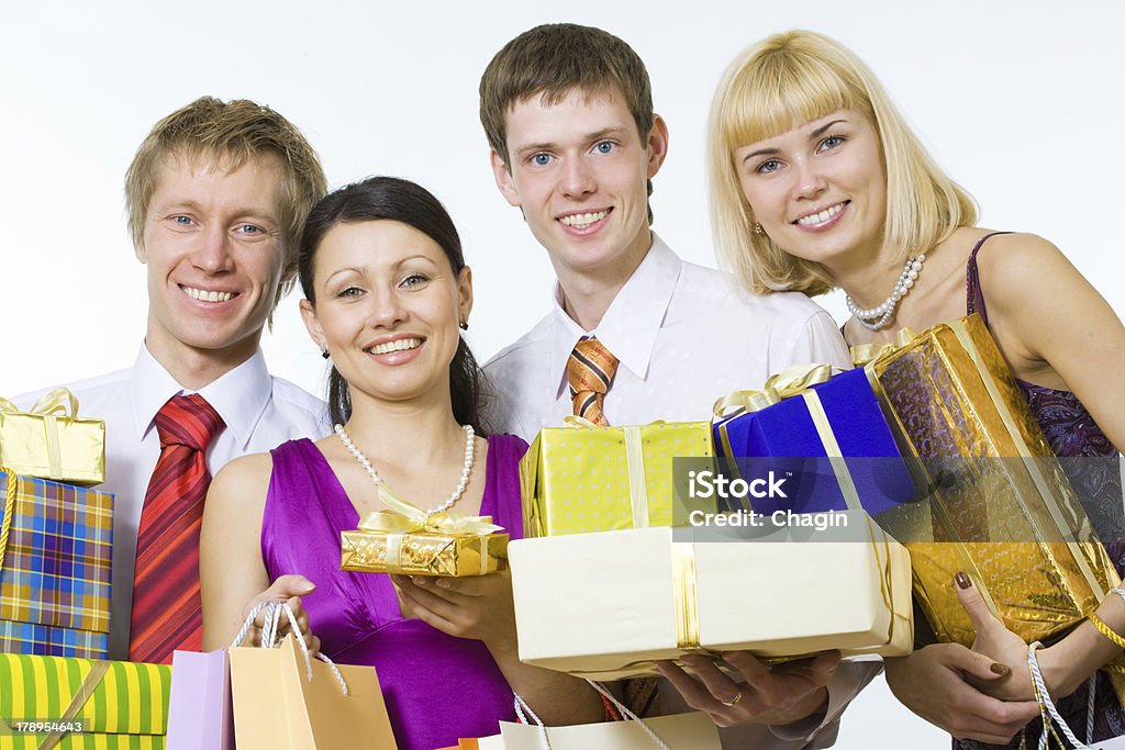 Gente sonriente con los regalos - Foto de stock de Acontecimiento libre de derechos