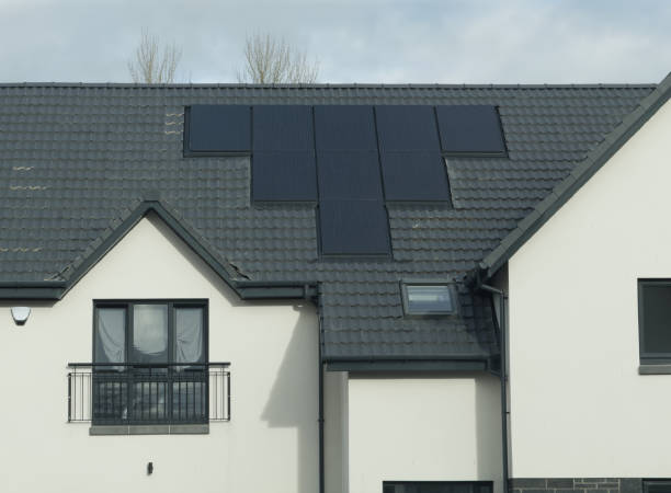 istock Solar panels installed on home roofs at new housing development 1789547102
