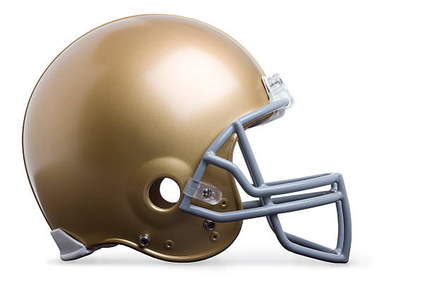 Gold football helmet isolated profile view stock photo