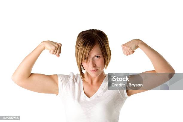 Photo libre de droit de Girl Power Femmes Bodybuilder Montre Ses Biceps Gros Plan banque d'images et plus d'images libres de droit de 25-29 ans