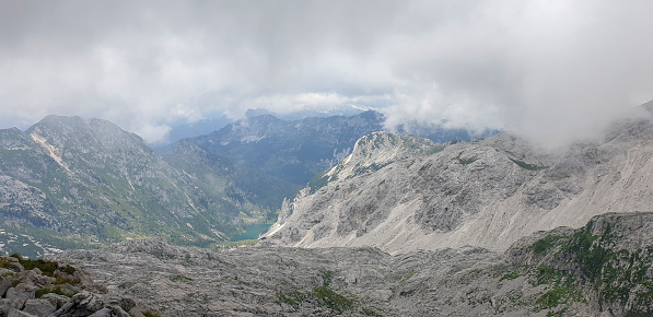View on lake Krn from high up, from the top of Mount Krn on foggy day, Julian Alps, Slovenia
