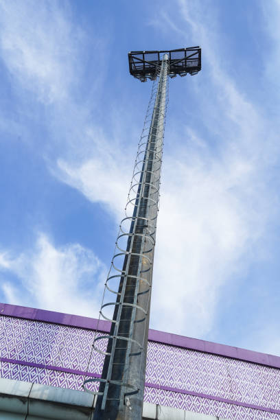 istock Sports stadium light tower on blue sky background 1789564239