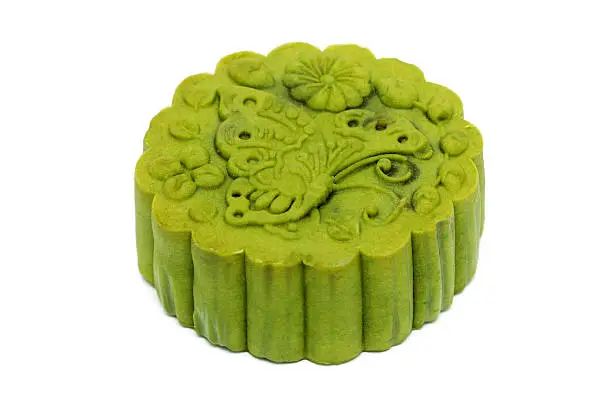 Close up of a greentea flavor mooncake on white background.