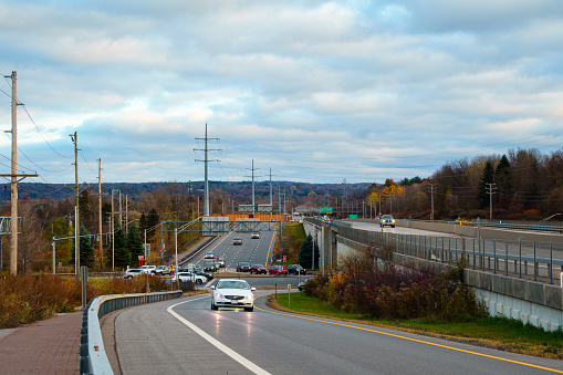 New Hartford, New York - Nov 11, 2023: Close-up Landscape Autumn View of an American Highway Traffic.