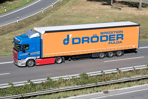 Engelskirchen, Germany - September 21, 2019: Dröder Scania truck with curtainside trailer on motorway