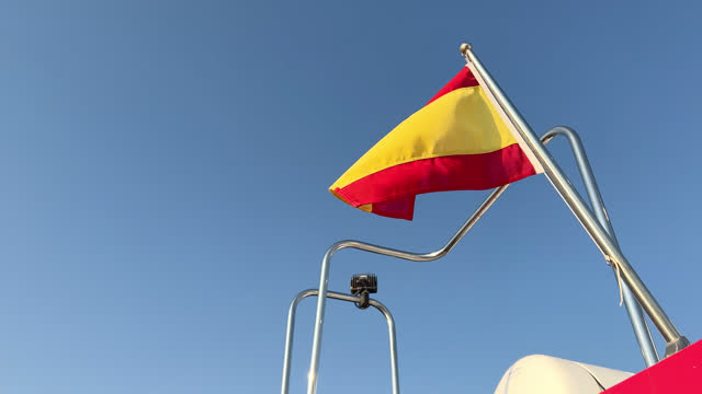 Spanish-Colored flag flying in the wind