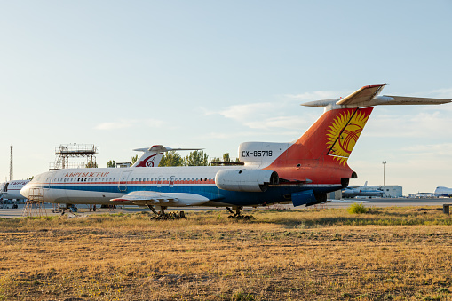 Bishkek, Kyrgyzstan - September 26, 2023: Disassembled plane in the aircraft graveyard