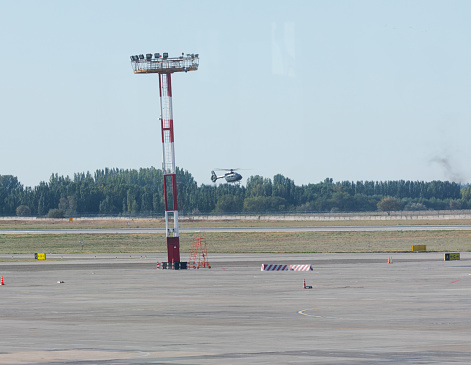 Bishkek, Kyrgyzstan - September 26, 2023: Flying Airbus H145 helicopter at the Manas International Airport