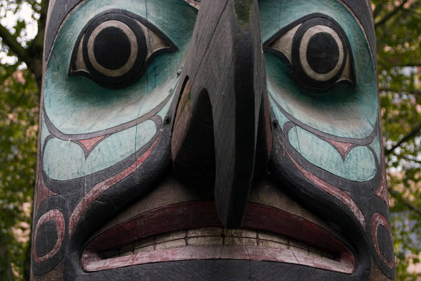 Totem Pole Detail "Detail of a Totem Pole in Seattle, Washington" pacific northwest totem poles stock pictures, royalty-free photos & images
