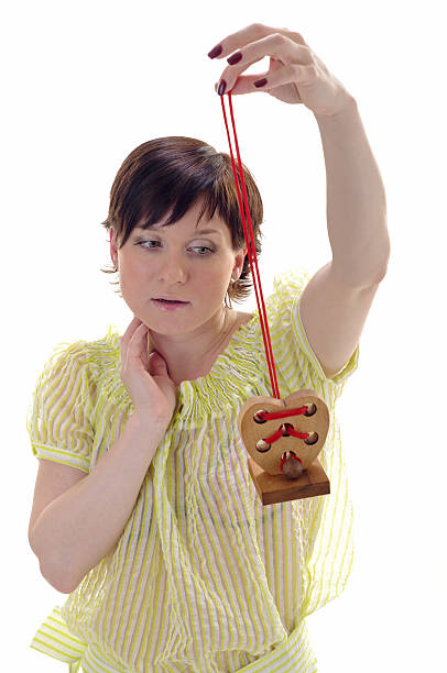 Woman with wooden heart on the branch stock photo