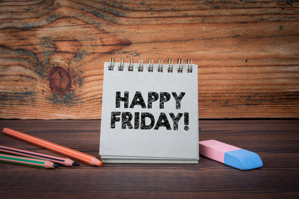 istock Happy Friday. Cardboard notepad on wooden texture table 1789609751