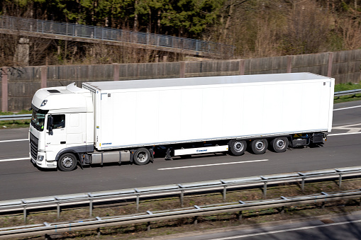 Wiehl, Germany - April 4, 2020: DAF XF truck with box trailer on motorway