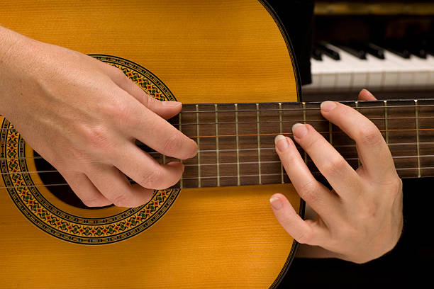 musician plays a guitar stock photo