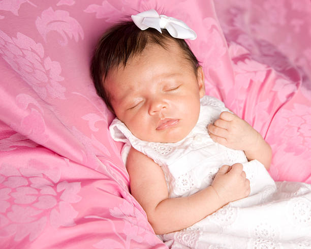 istock Precious Sleeping Newborn Baby on Pink Background 178964696