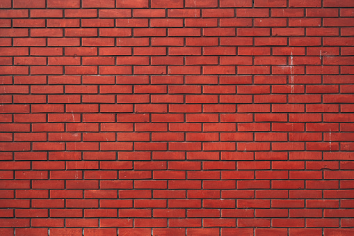 Red brick wall as background. Graphic design element.