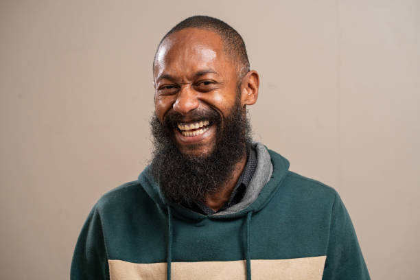 istock Bearded black man smiling on pastel background. 1789658289