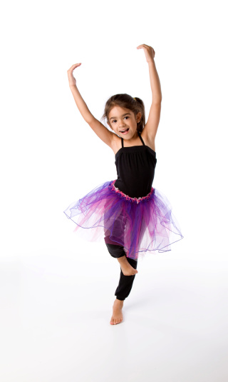 Five year old Hispanic girl dances ballet.
