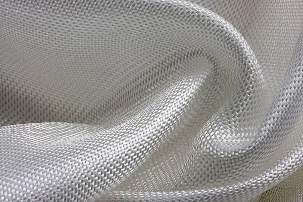 macro of fiberglass cloth composed into a swirl pattern