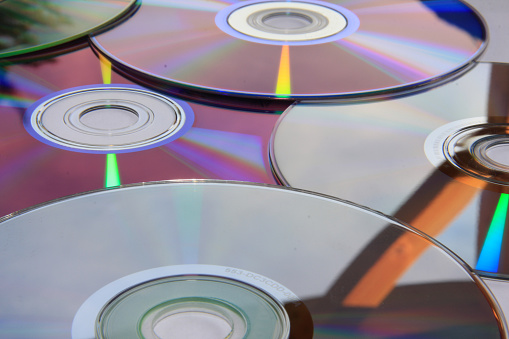 Isolated CD with refracted rainbow pattern. Some scratches and dust - just like every CD in your collection.