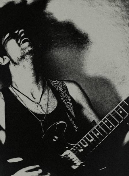 The rock musician. Portrait of a young guitarist of a rock band. 80s rock guitar stock pictures, royalty-free photos & images