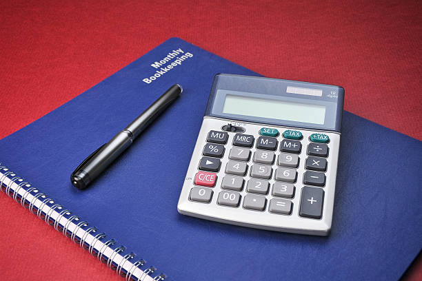 Business Books, Adding Calculator, Expenses, Bookkeeping, Pen stock photo