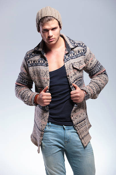 istock casual man looks at you with hands on lapels 178968497