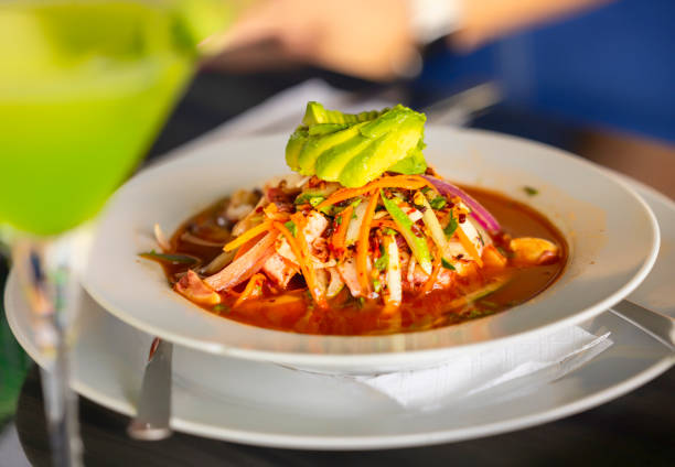 Ceviche is a dish that consists of a marinade of fish, seafood or both in citrus dressings, prawns, lemon, orange, onion, coriander, tomato sauce, mayonnaise with popcorn and chili