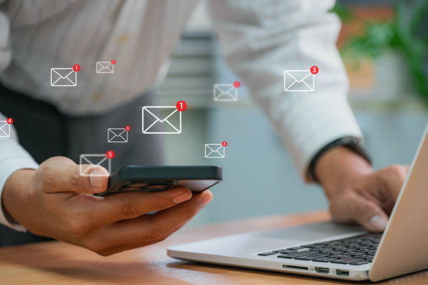 istock Businessman using email on smartphone with notification alerts for business email online communication and digital marketing. Email notifications in your inbox 1789699282
