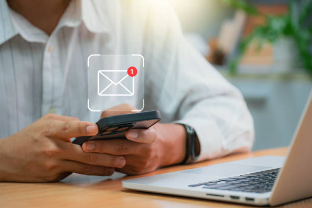 istock Businessman using email on smartphone with notification alerts for business email online communication and digital marketing. Email notifications in your inbox 1789699797