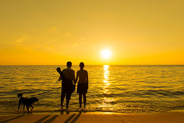 istock Silhouette of a couple and dog 178971501
