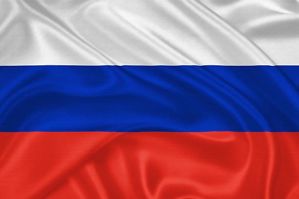 Flag of  Russia Flag of  Russia waving with highly detailed textile texture pattern russian flag stock pictures, royalty-free photos & images